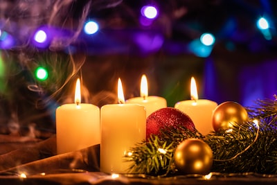 An image featuring a beautifully decorated holiday-themed living room, adorned with twinkling lights and a festive fireplace display